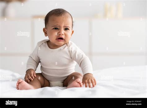 Portrait Of Sad Black Baby Crying Alone Stock Photo Alamy