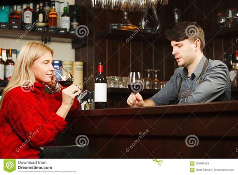 Barman And Girl Visitor Drink And Talk About Wine Stock Image Image