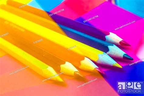 Colorful Pencils On Colored Paper Abstract Background Stock Photo