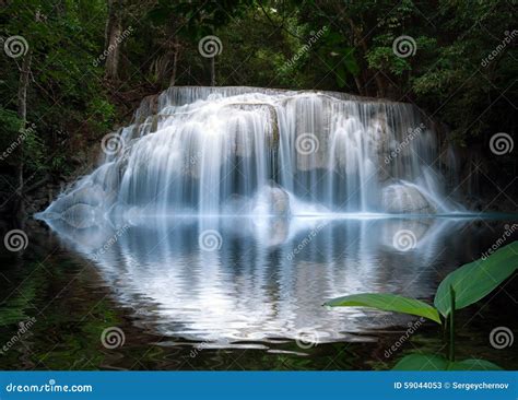 Smooth And Silky Beautiful Waterfall With Reflection In Water Stock
