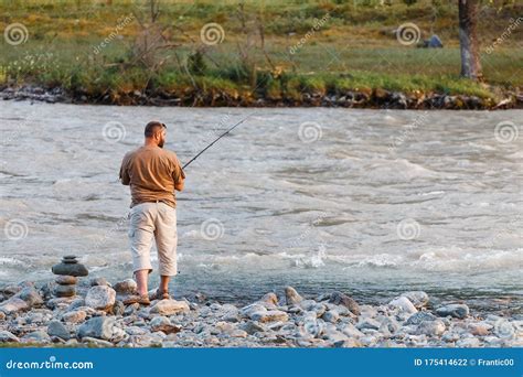 Man Fishing On The Mountain River Editorial Photography Image Of