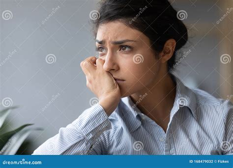 Sad Melancholic Indian Woman Looking Away Thinking Of Problems Alone