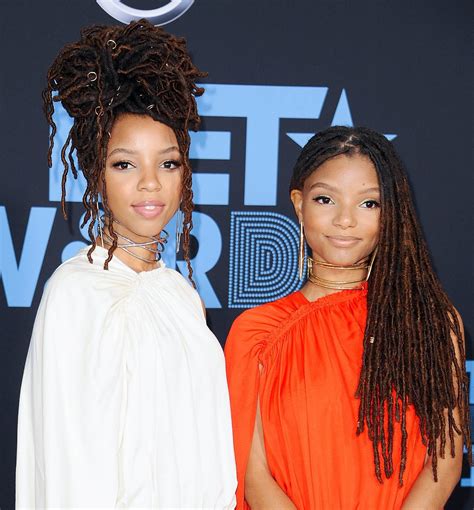 chloe and halle bailey prom hair updo curly prom hair updo elegant hair hair medium hair