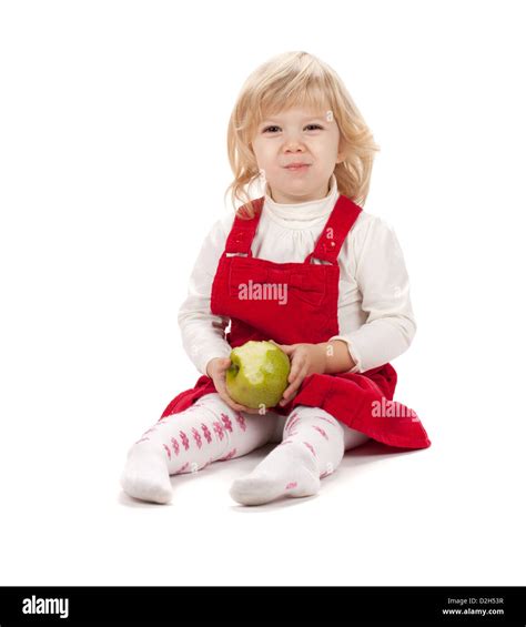 Baby Girl Eating Apple Isolated On White Background Stock Photo Alamy