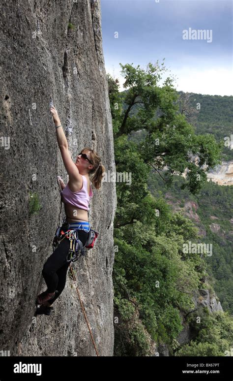 A Woman Climbing On Limestone Cliffs Near Siurana A Village Near Reus