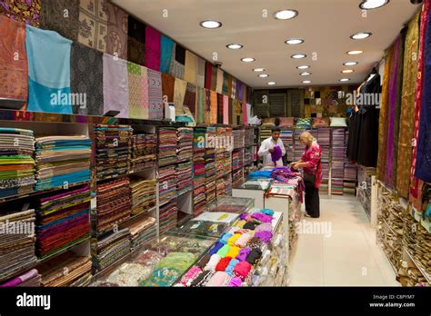 Tourist Woman MR Buying A Scarf Or Pashmina In The Dubai Textile Souk Or Bur Dubai Souk Dubai