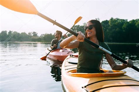 Beautiful Couple Kayaking On River Together Stock Photo By