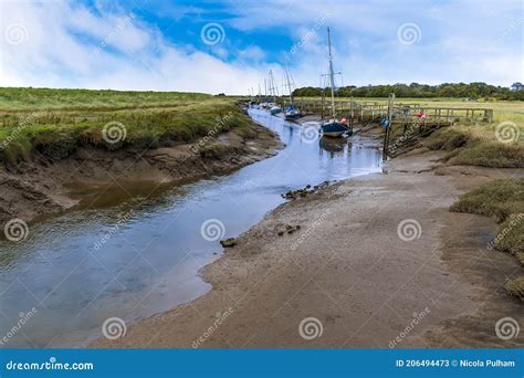 A View Along A Muddy Creek Looking Out To Sea At Low Tide At Gibraltar