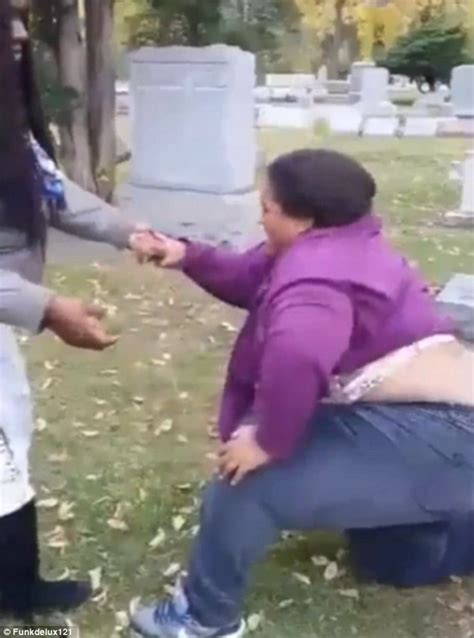 youtube video sees large lady rolling around on a grave after falling over daily mail online