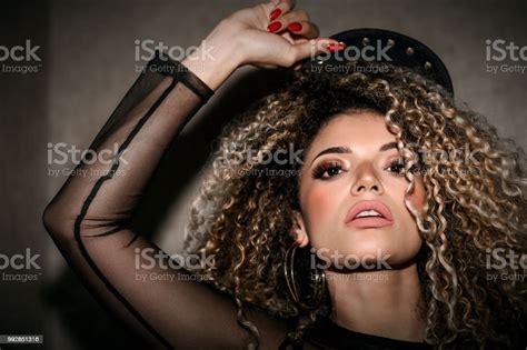 Beautiful Woman Portrait With Gorgeous Hair Holding And Wearing Hip Hop