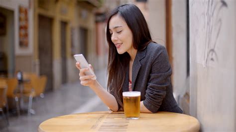 Smiling Young Woman Relaxing With Beer Stock Footage Sbv 305371004 Storyblocks