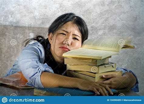 Young Stressed And Frustrated Asian Korean Teenager Student Working