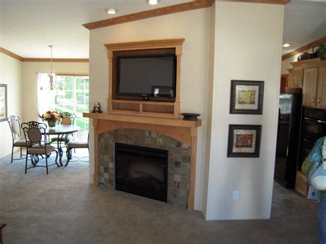 Corner Fireplace With Flat Screen Lcd Tv Above The Dining Room Is