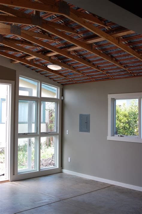 Insulation is easy to install when following the proper steps. Exposed Ceiling + Insulation | Basement ceiling, Exposed ...