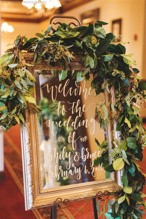 Elegant Wedding Welcome Sign Features Hand Calligraphy In White Ink On