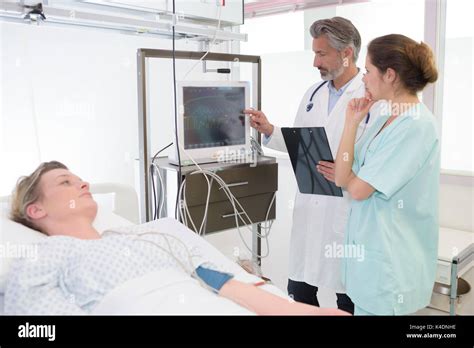 Doctor And Nurse Visiting A Recovering Patient Stock Photo Alamy