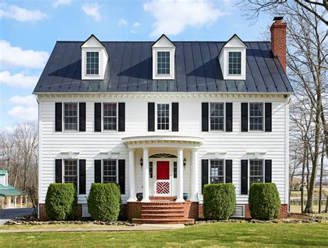A Traditional Center Hall Colonial W White Painted Exterior And Black
