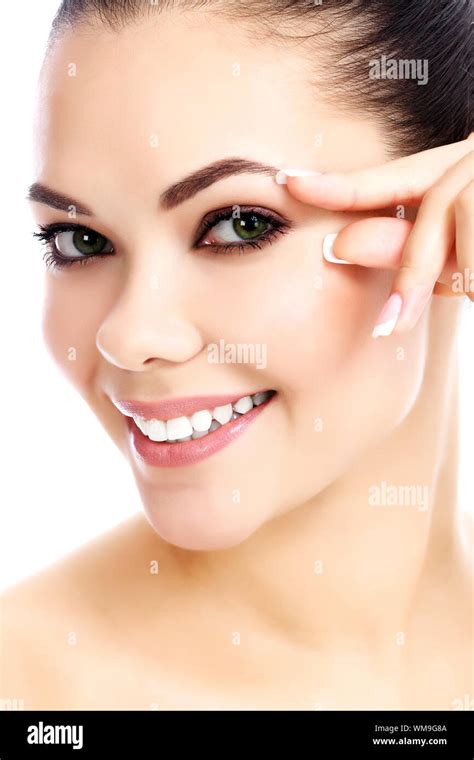 Portrait Of Beautiful Woman Pinching Skin On Her Face White Background