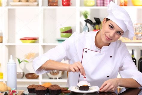 Young Woman Chef Cooking Cake In Kitchen — Stock Photo © Belchonock
