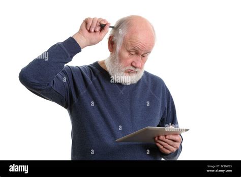 Funny Old Man Using Tablet Computer And Puzzled Isolated On White