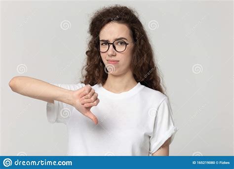 Unhappy Girl Show Thumbs Down Disappointed With Bad Service Stock Photo