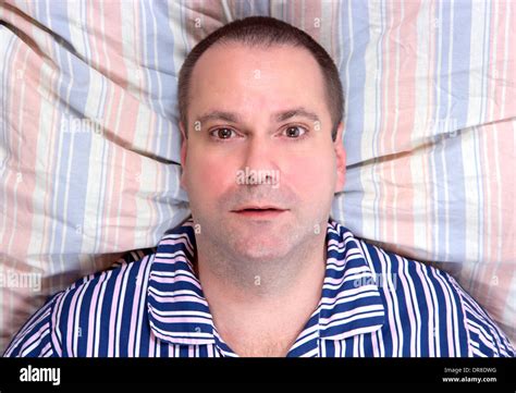 Lying Man Resting In Bed Stock Photo Alamy