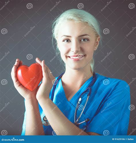 Young Doctor Woman With Stethoscope Holding Heart Stock Photo Image
