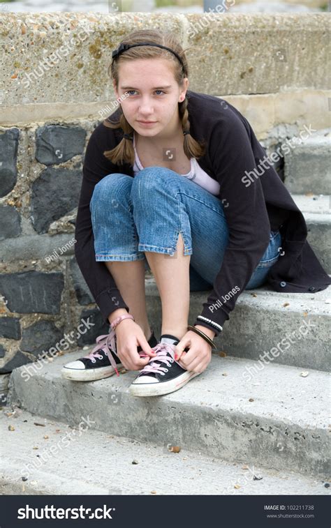Teenage Girl Sitting On Steps Tying Stock Photo Shutterstock