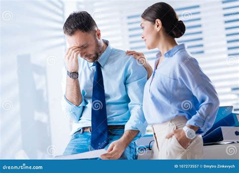 Tired Employee Being Fed Up With Work While His Colleague Comforting