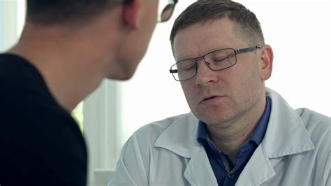 Male Patient Having Consultation With Male Doctor In Medical Office Stock Video Footage 0023