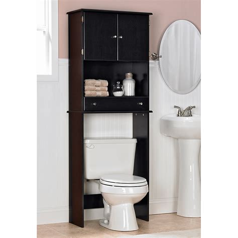 Space saving bathroom cabinet with durable wooden construction based on high legs. Ameriwood Espresso Bathroom Space Saver at Hayneedle