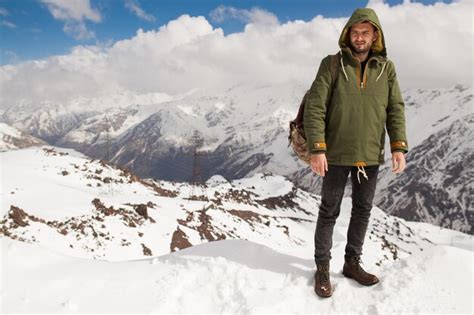 Free Photo Young Hipster Man Hiking In Mountains Winter Vacation