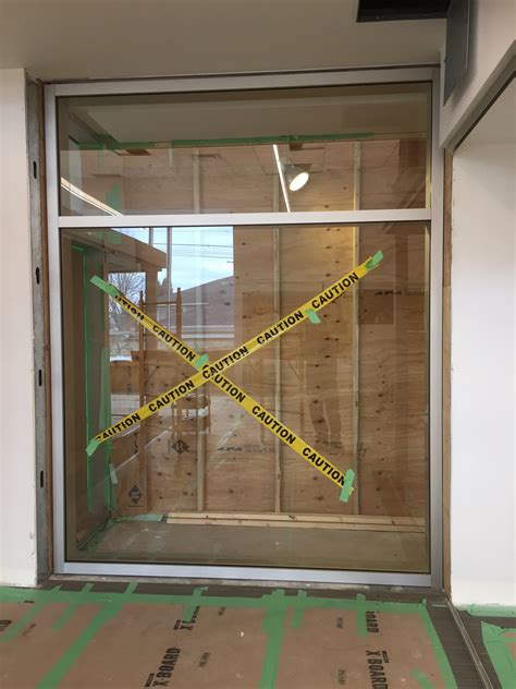 Quality represented through elegance and minimalism. Interior office glass walls, sliding glass doors, curtain ...