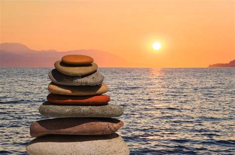 Stack Of Stones On Beach At Sunset Stock Photo Image Of Beauty Stone