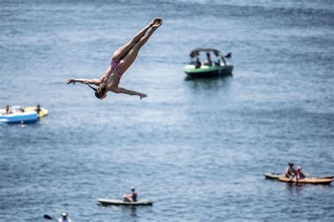 Stunning Photos Show People Cliff Diving From Texas Hells Gate