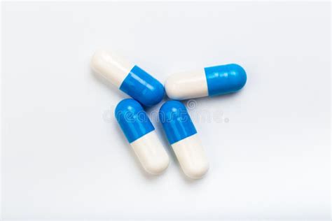 Set Of Blue And White Capsules On A White Background Stock Photo