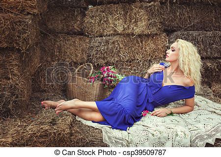 Woman Lying On Hay In The Village Blonde Woman Lying On Hayloft Near A