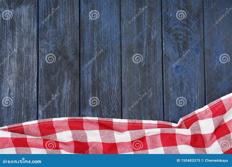 Checkered Picnic Blanket On Color Wooden Background Top View Stock