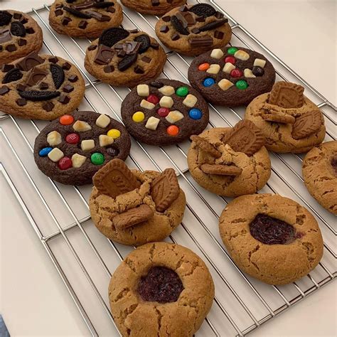 Cookies With M And Ms On Them Are Cooling On A Rack