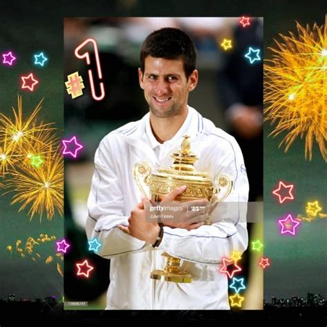 A Man Holding A Trophy In Front Of Fireworks
