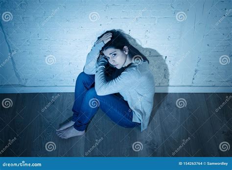 Portrait Of Sad Depressed Young Woman Feeling Distressed Alone At Home