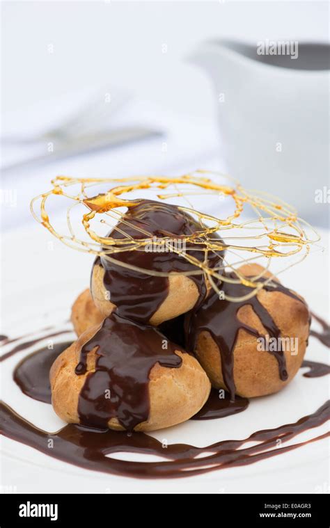 a profiterole cream puff or choux à la crème a french dessert choux pastry ball filled with