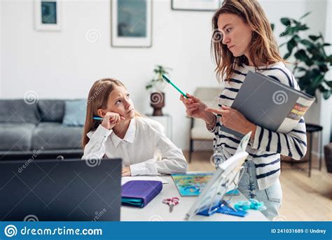 mother controls her daughter to learn her lessons stock image image of assignment helping