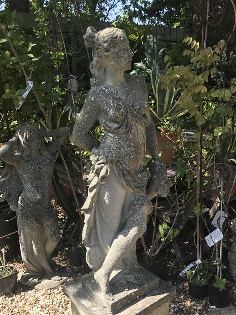 The Old Piggery Garden Centre Weathered Statue Of Maiden And Flowers