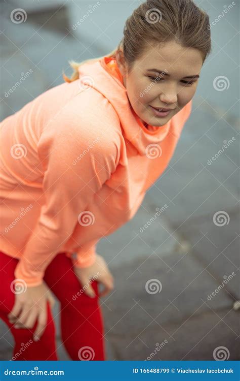 Smiling Woman Standing Bent Over On The Street Stock Image Image Of Female Happy