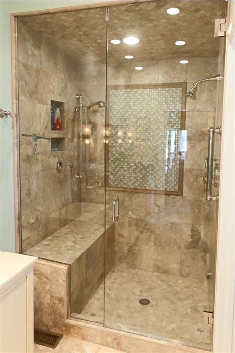 check out this lovely tile shower we did it has a nice bench seat and beautiful glass shower