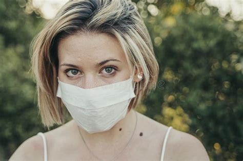 blonde masked girl enjoying the sunset during the pandemic stock image image of caucasian