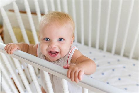Happy Baby Girl In Crib By Stocksy Contributor Meaghan Curry Stocksy
