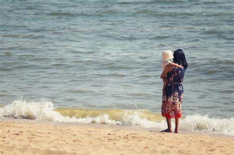 Young Mother Holding Her Newborn Daughter Beach Stock Photos Free