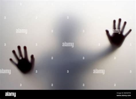 An Obscured Figure Behind Frosted Glass Stock Photo Alamy